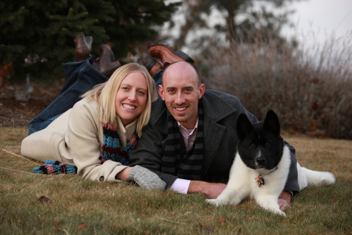 Dentists Elizabeth and Travis with a dog in Spokane.